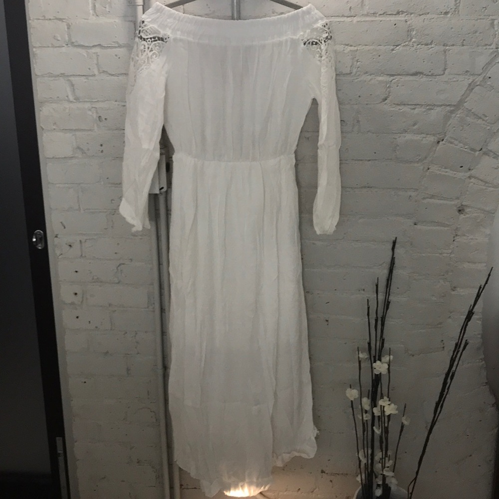 Brand new white off the shoulder mid length dress.